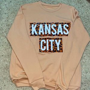 Pink dinosaur boutique large “Kansas City” crew neck.
